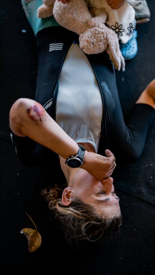 Victoria Stansfield lying on the ground after finishing