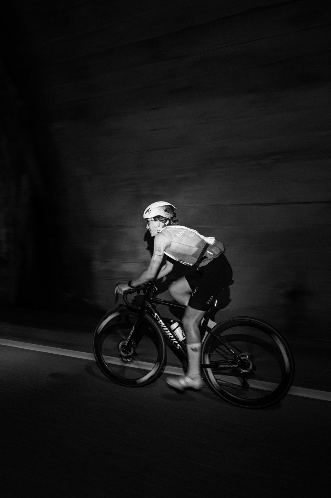 Victoria Stansfield riding alone through a dark underpass