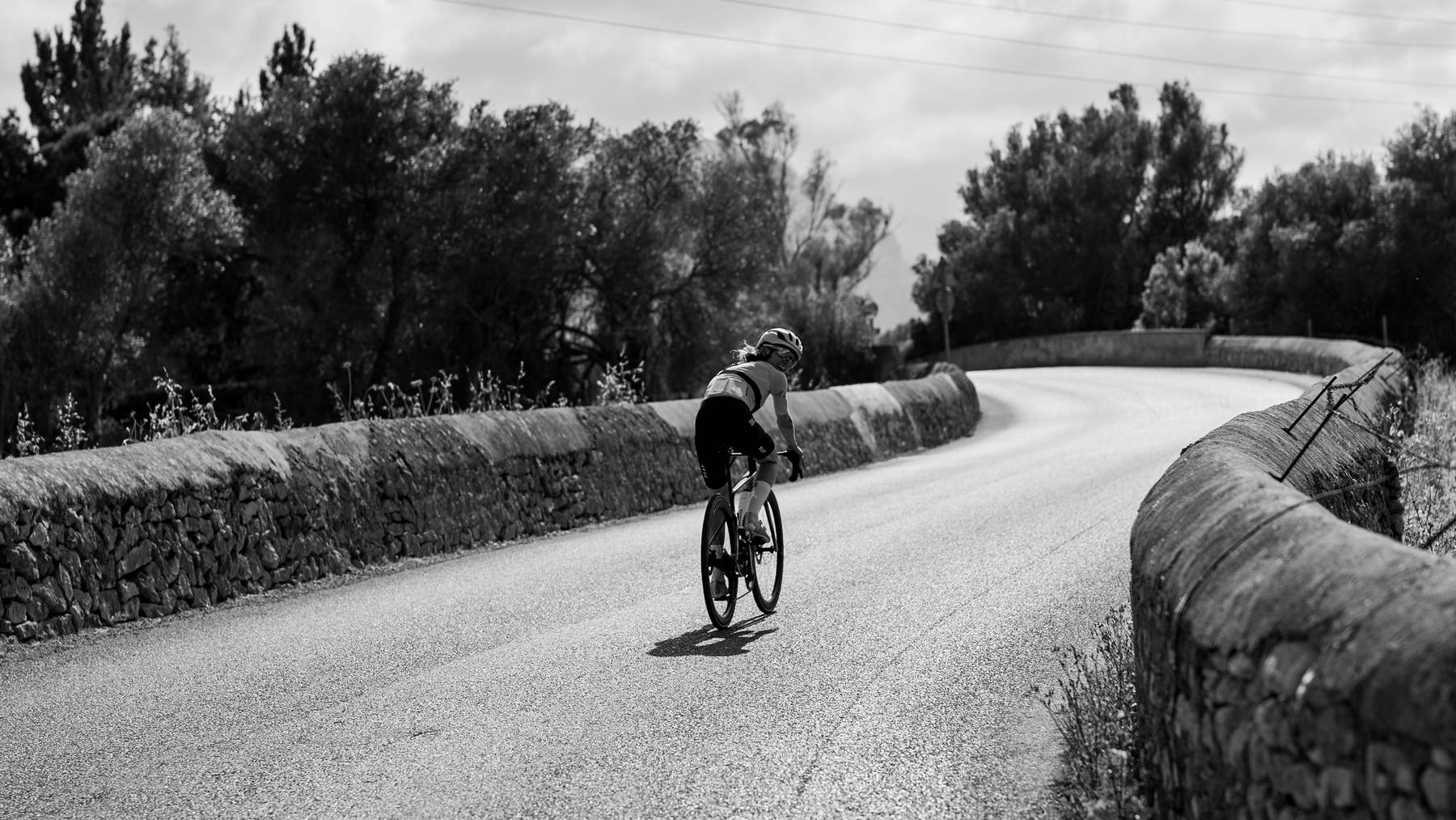 Victoria Stansfield riding a walled lane in Mallorca